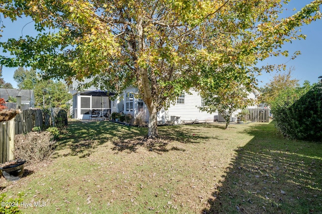 view of yard featuring a sunroom