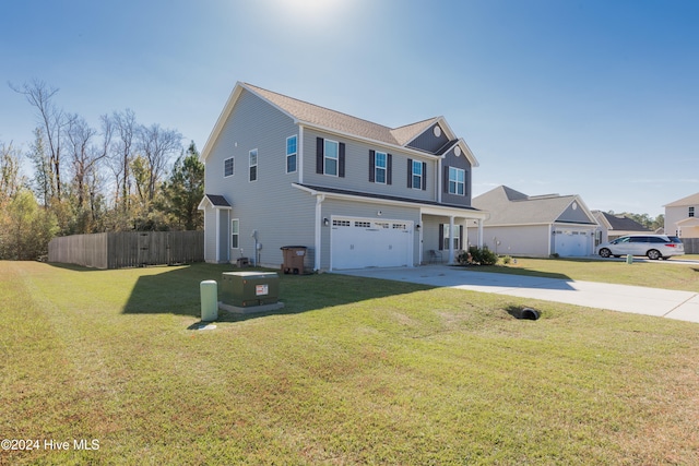 view of property with a garage and a front yard