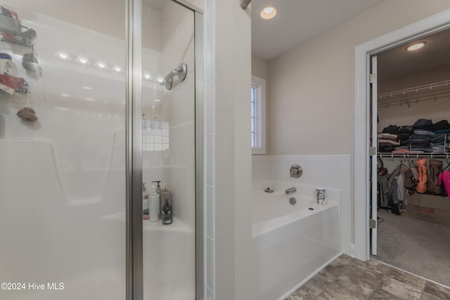 bathroom with independent shower and bath