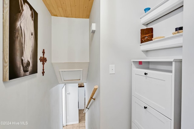 staircase with wooden ceiling