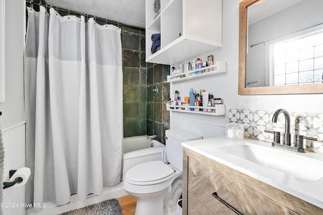 full bathroom featuring vanity, shower / bath combination with curtain, toilet, a textured ceiling, and wood-type flooring