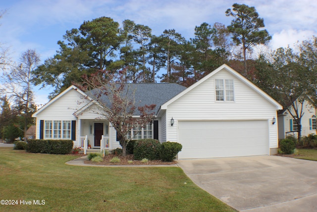 view of front facade with a front yard, a porch, and a garage