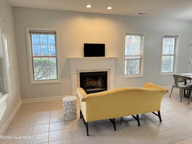 tiled living room with a fireplace