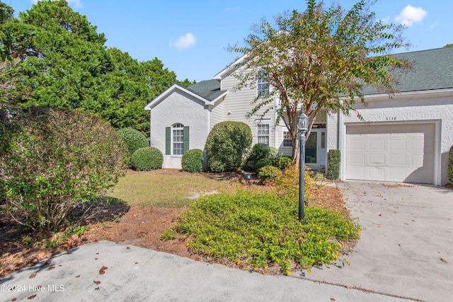 front of property with a garage