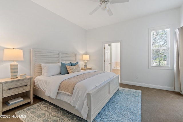 carpeted bedroom with ceiling fan, connected bathroom, and baseboards