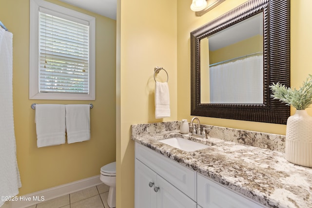 full bathroom featuring baseboards, vanity, toilet, and tile patterned floors