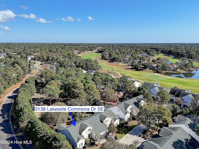 bird's eye view with a residential view, a water view, a wooded view, and golf course view