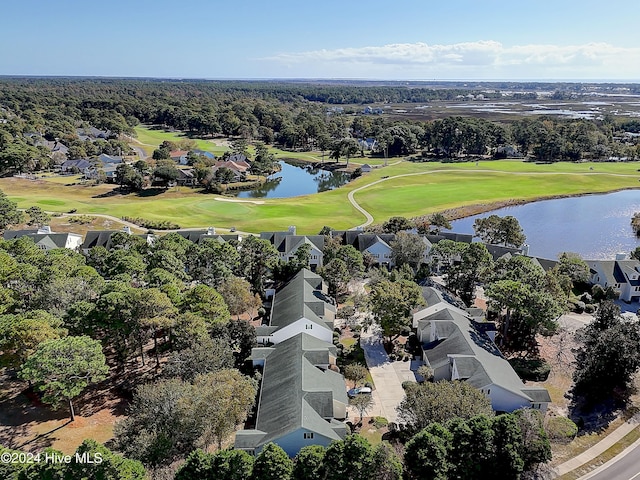 birds eye view of property featuring a water view and golf course view