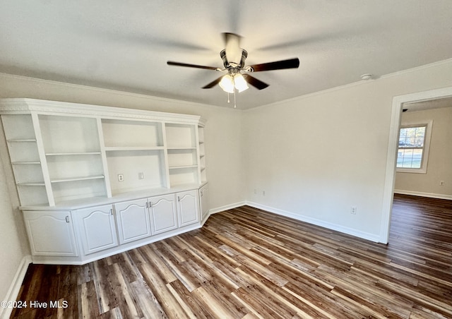 unfurnished room featuring ceiling fan, hardwood / wood-style floors, and crown molding