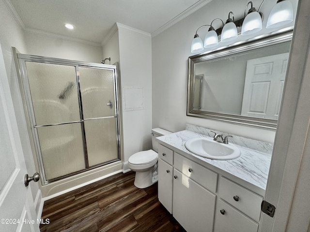 bathroom featuring crown molding, a shower with door, vanity, and hardwood / wood-style flooring