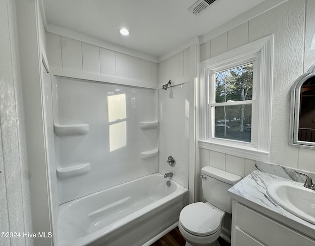 full bathroom featuring vanity,  shower combination, and toilet