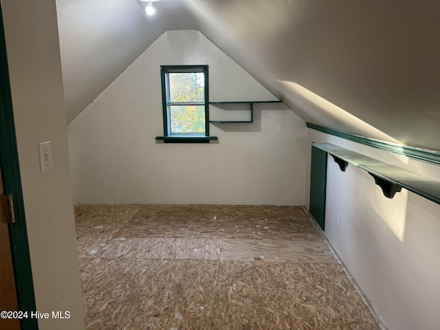 bonus room featuring vaulted ceiling