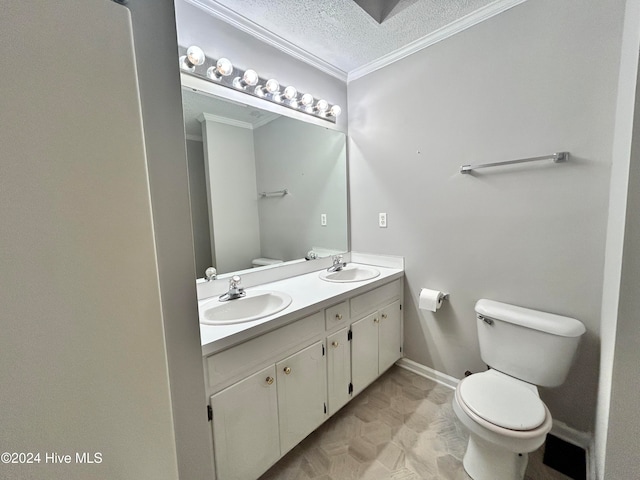 bathroom with vanity, toilet, a textured ceiling, and ornamental molding