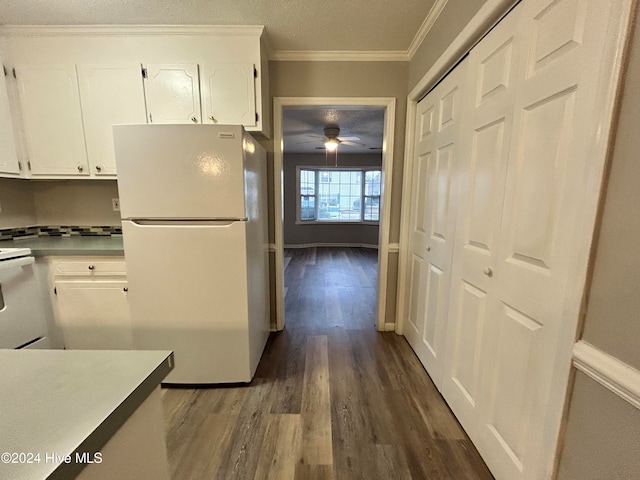 kitchen featuring dark hardwood / wood-style flooring, white cabinetry, white fridge, and ceiling fan