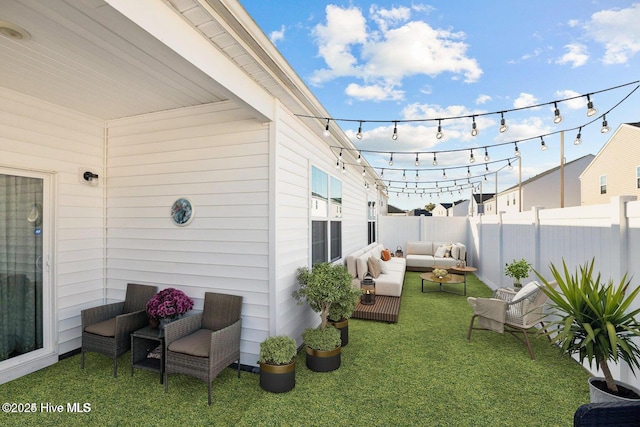 view of yard featuring outdoor lounge area and a fenced backyard