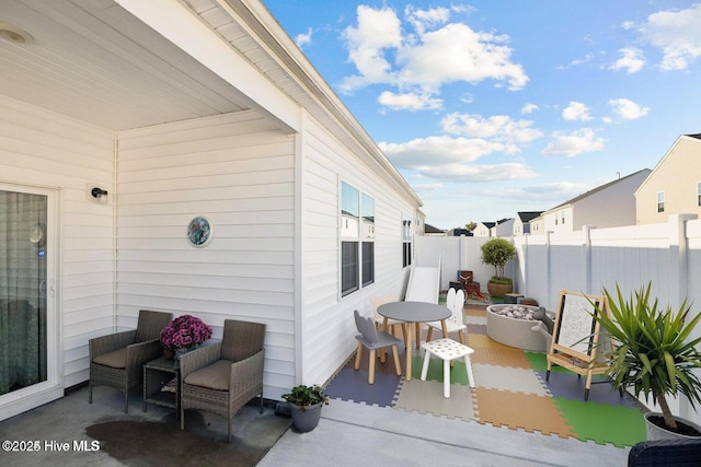 view of patio with a fire pit and fence private yard