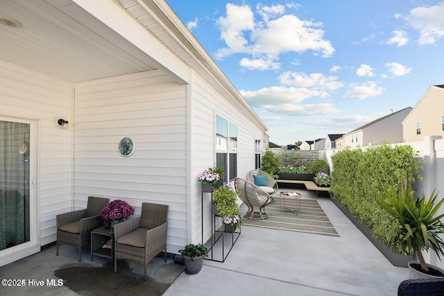 view of patio / terrace featuring fence