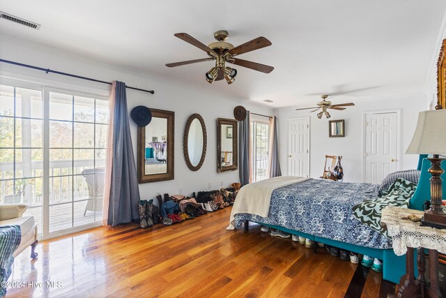 bedroom featuring ceiling fan, hardwood / wood-style flooring, crown molding, and access to exterior