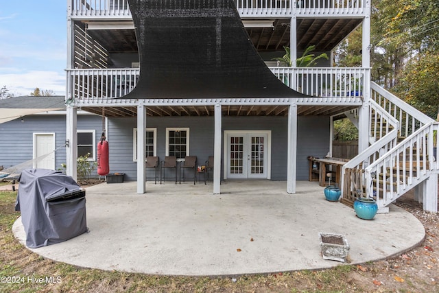 rear view of property with a patio and a deck