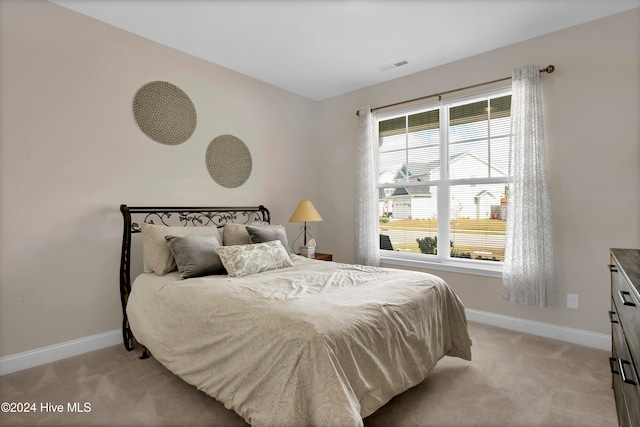 bedroom with light carpet