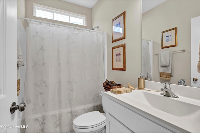 full bathroom with toilet, shower / bath combination with curtain, and vanity