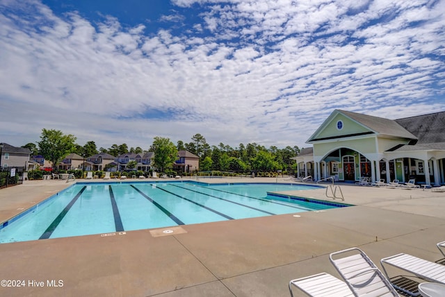 view of swimming pool with a patio area