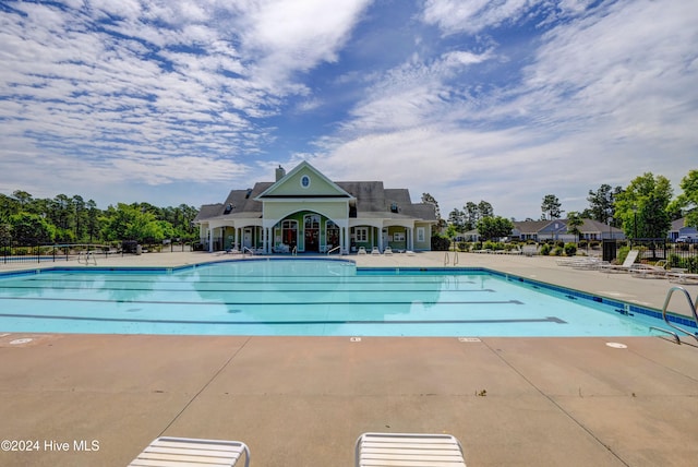 view of swimming pool with a patio