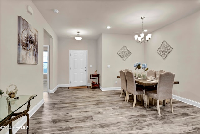 dining room featuring a notable chandelier and hardwood / wood-style flooring