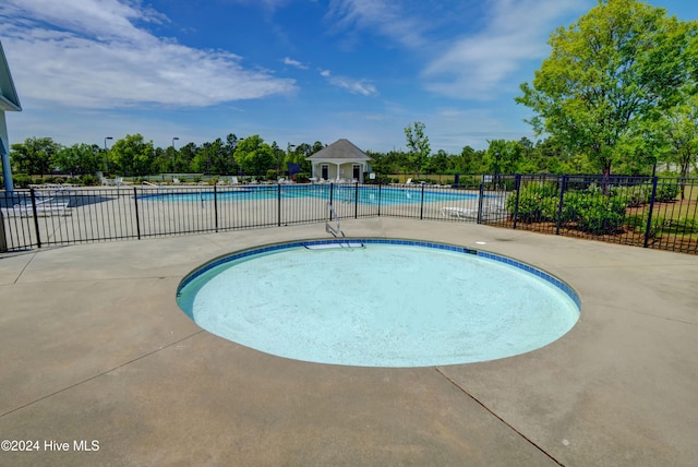 view of swimming pool featuring a patio