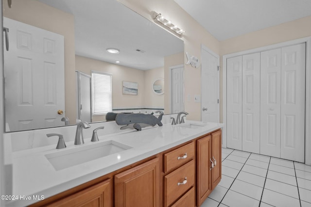 bathroom with vanity and tile patterned flooring