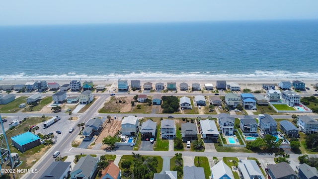 aerial view with a water view and a view of the beach