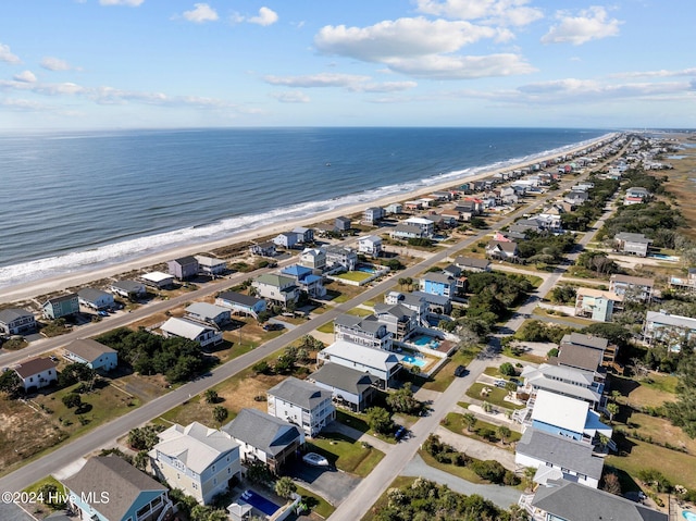 drone / aerial view with a view of the beach and a water view