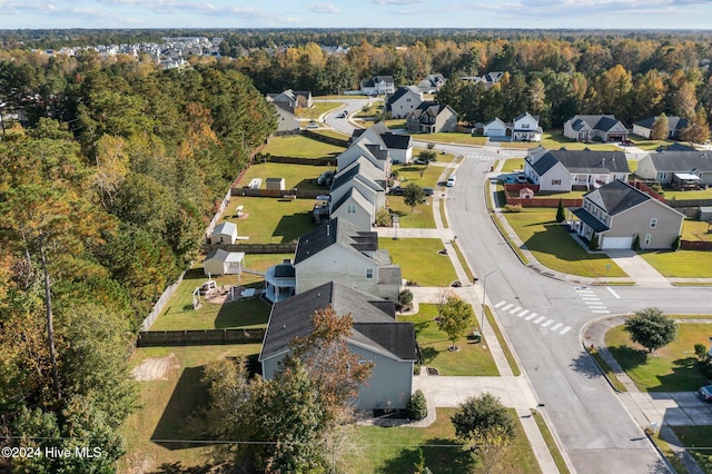 aerial view with a wooded view and a residential view