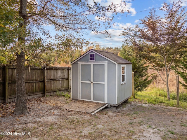 view of shed with fence