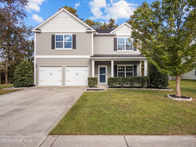 traditional-style house with concrete driveway, covered porch, a garage, and a front lawn