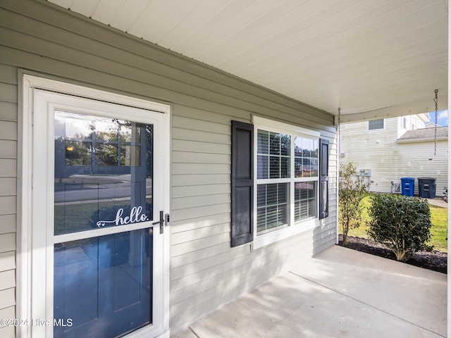 doorway to property featuring a porch
