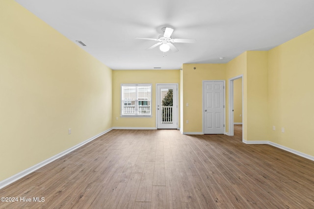 spare room featuring ceiling fan and light hardwood / wood-style floors