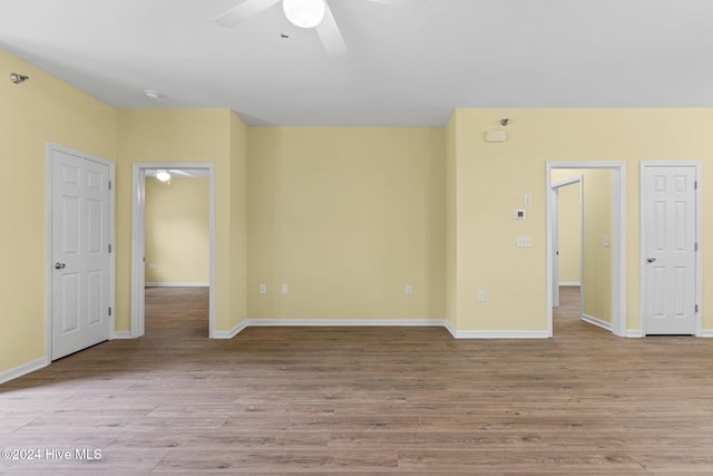 unfurnished room with ceiling fan and light hardwood / wood-style floors