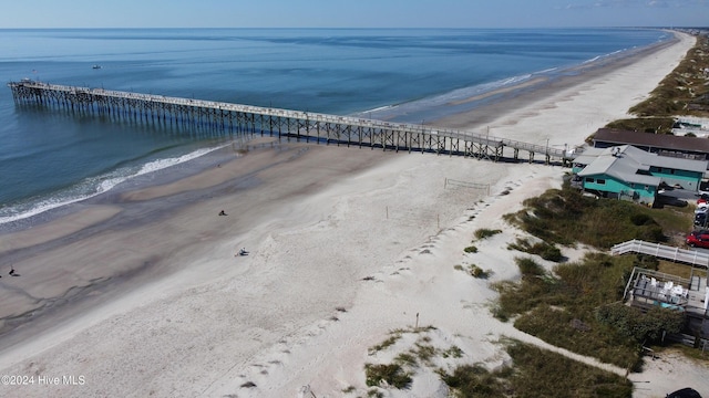 aerial view featuring a view of the beach and a water view