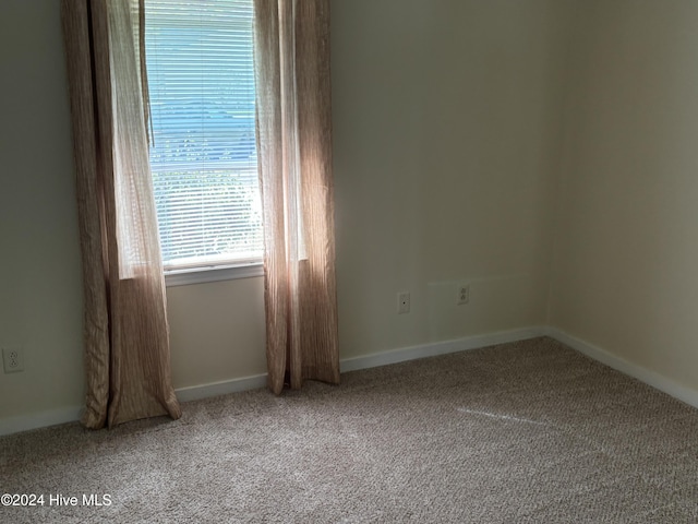 empty room featuring carpet flooring