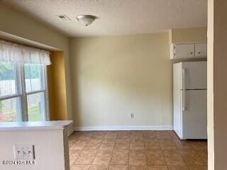 kitchen featuring white refrigerator