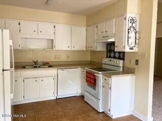 kitchen with white cabinetry, white appliances, and sink