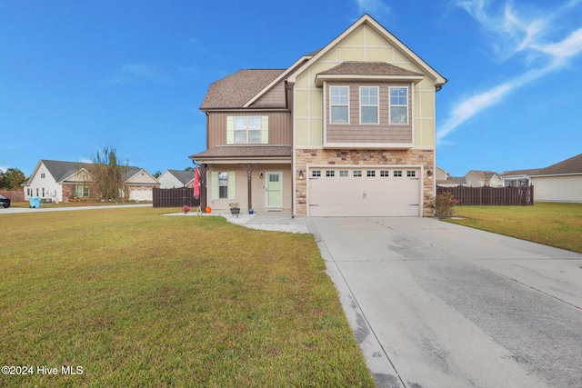 craftsman-style home featuring a front yard and a garage