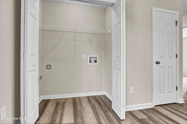 laundry room featuring washer hookup and hardwood / wood-style floors