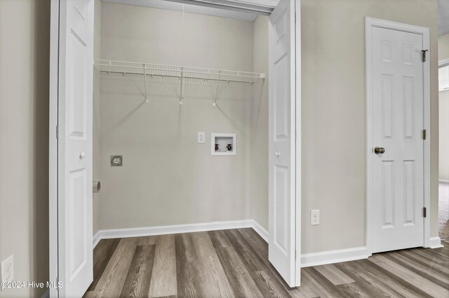 1912 Paulette Rd, Morehead City, NC 28557 - laundry room featuring wood finished floors, washer hookup, and baseboards