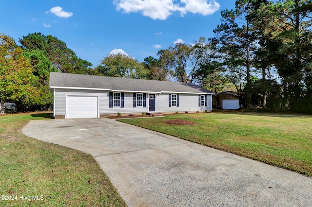 ranch-style home with a front yard and a garage