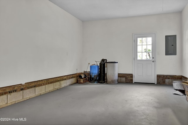 1912 Paulette Rd, Morehead City, NC 28557 - unfurnished living room featuring electric panel and concrete flooring