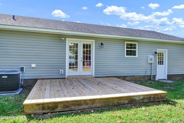 back of house with cooling unit and a deck