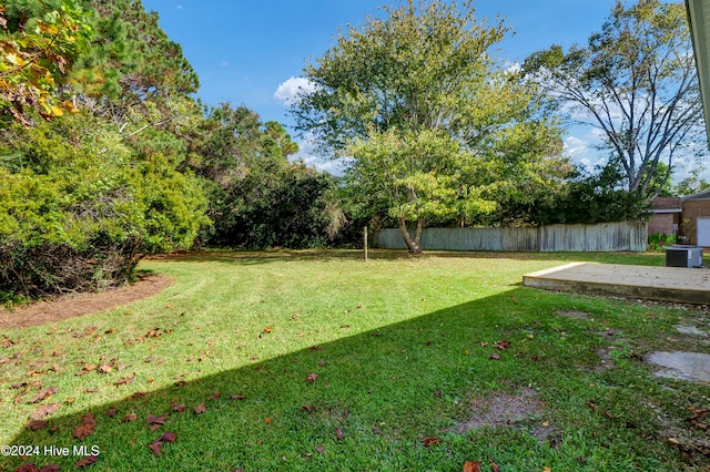 view of yard featuring a patio area and central AC unit