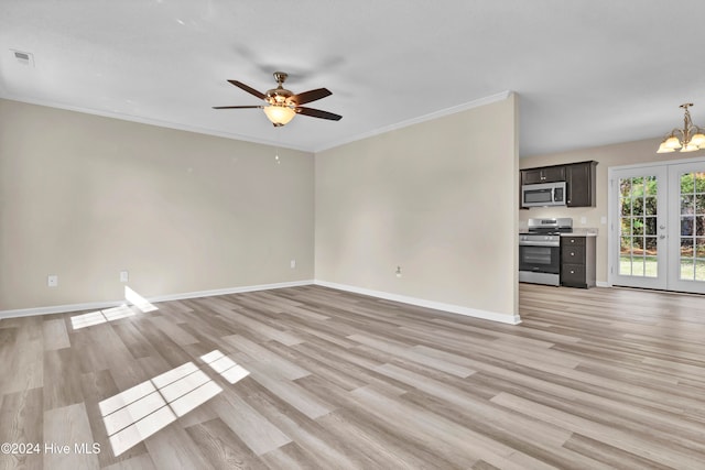 unfurnished living room featuring ornamental molding, french doors, ceiling fan with notable chandelier, and light wood-type flooring